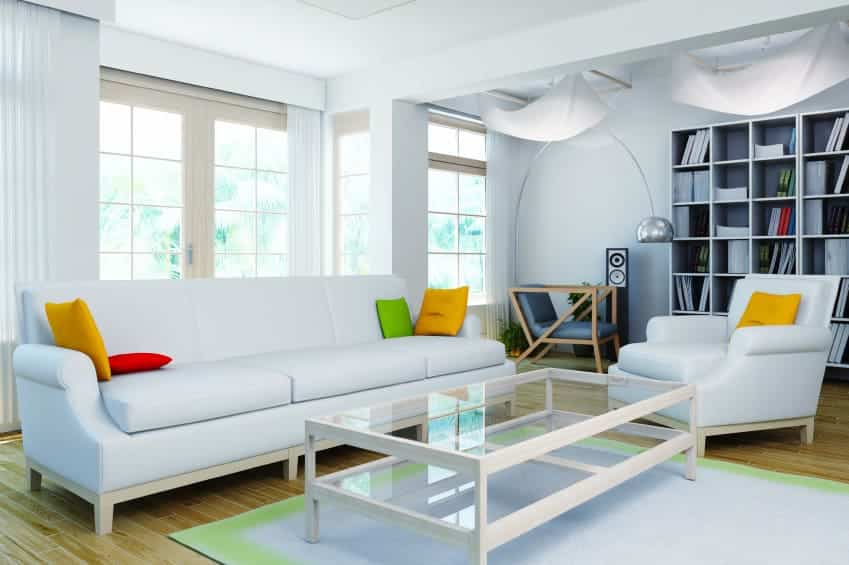 Room at daylight with furniture, colored cushions and library