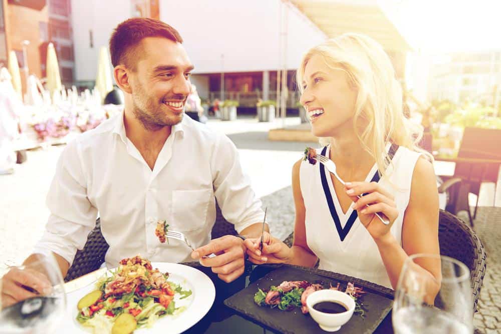 Guests happily eating steak at texas roadhouse