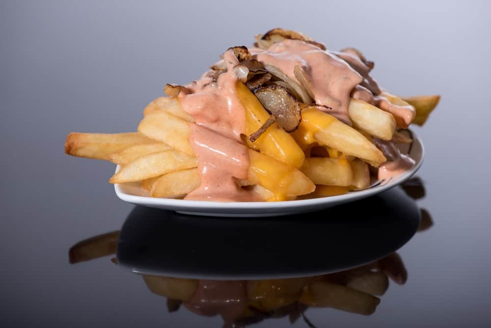 Animal-style french fries with caramelized onions and dressing.
