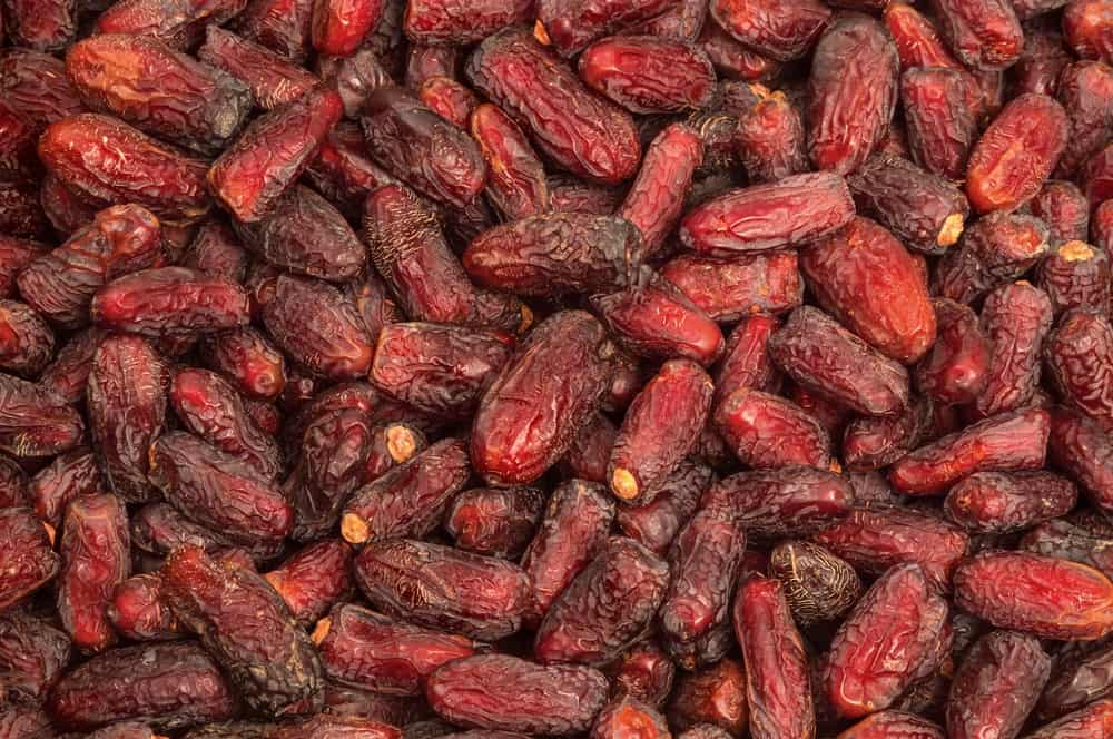 A stack of Ambera Dates with its deep red hue.