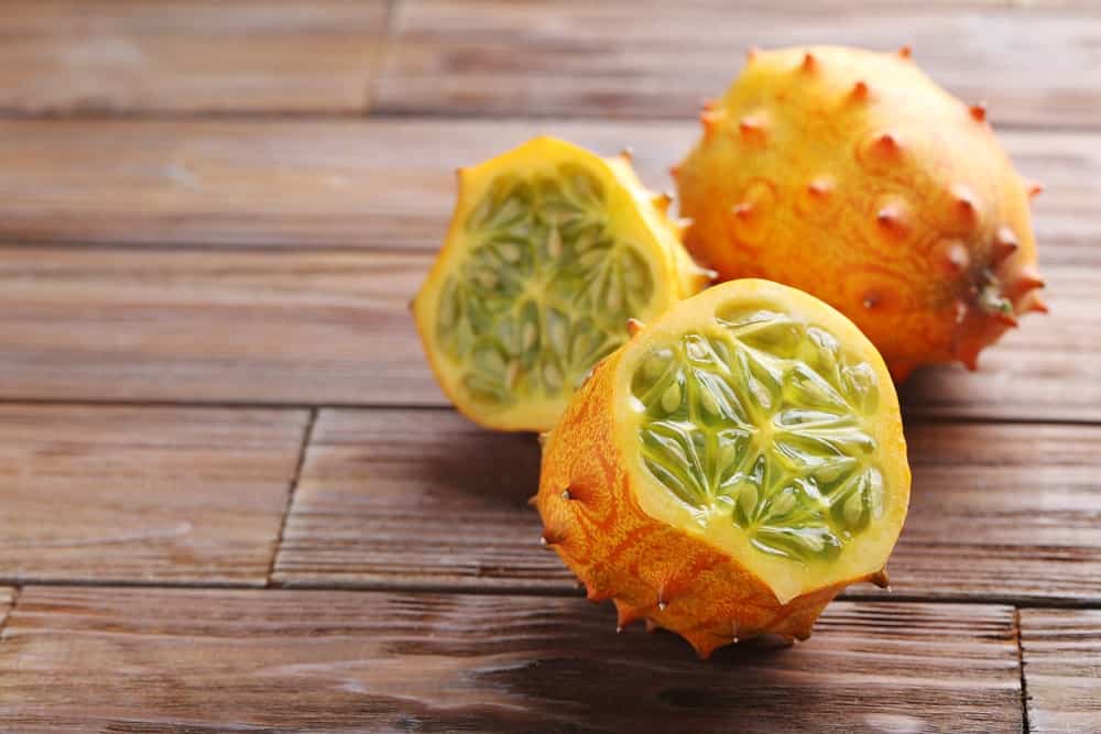 Kiwano Fuit or Horned Melon sliced with juicy insides exposed.