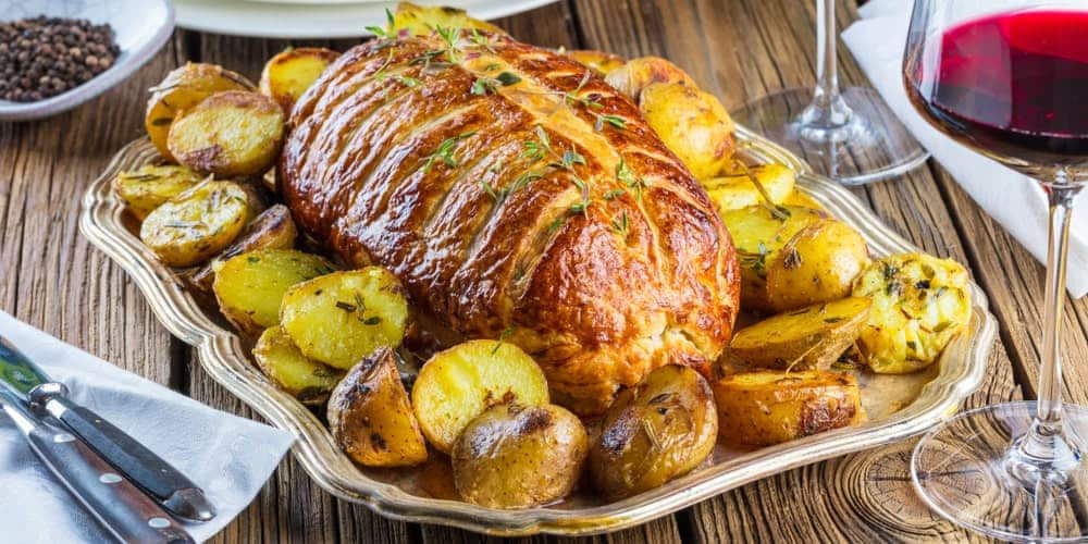 Classic Beef Wellington Dish On A Wooden Desk.