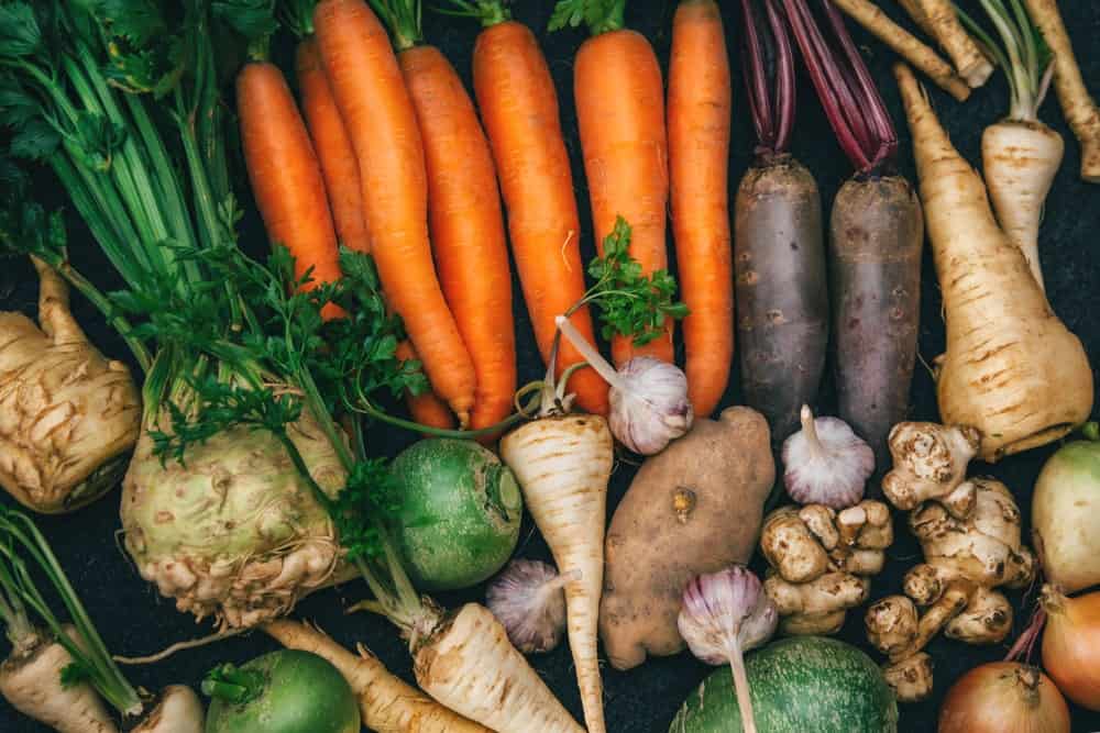 Carrots, parsley, turnip, and onions on display