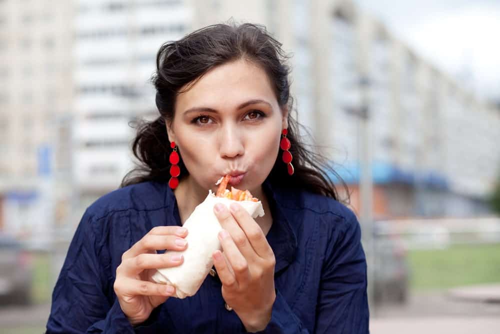 Woman Eating a Burrito