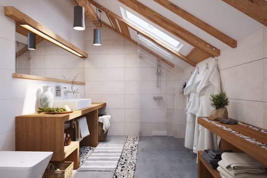 The small bathroom features wooden vanity and wooden countertop with marble basin sink on top. This room also features a high vaulted ceiling and wooden cabinetry.