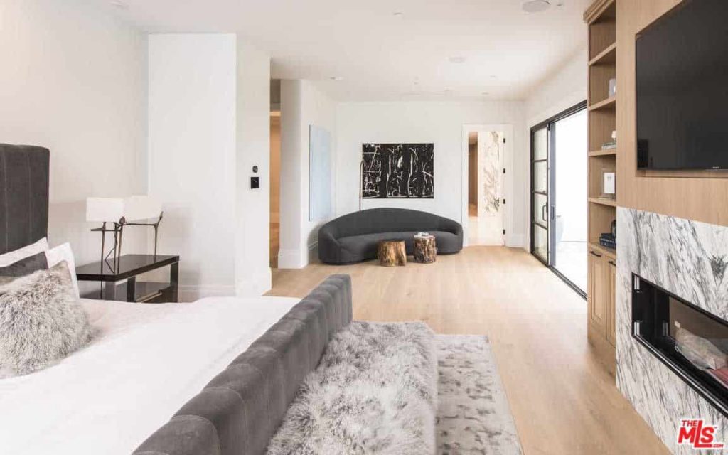 This room flaunts an extravagant fur rug, luxurious fur pillows, and fascinating work of art, all while keeping up an uncluttered, clean finishing style. That would be hard to pull off with some other shading on the walls.
