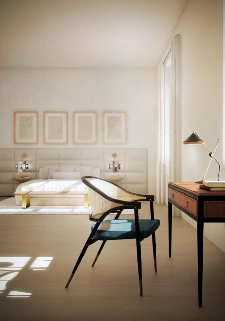 An elegant master bedroom featuring a gorgeous bed set up with four charming wall decors along with a stylish study desk on the side.