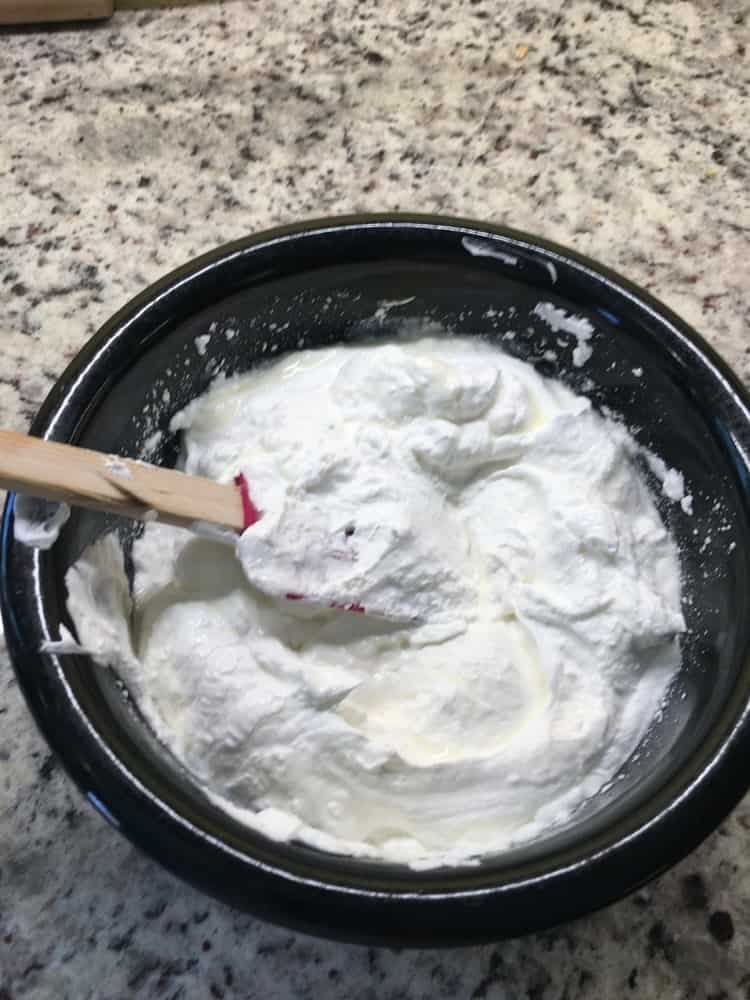 Mixing the filling with the use of a spatula.