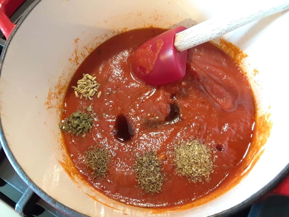 Stirring the sauce mixture.