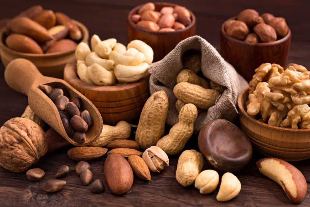 A table filled with the various types of nuts.