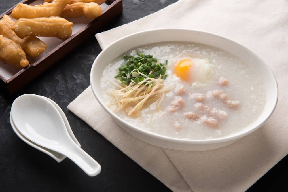 A bowl of congee with toppings.