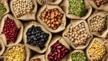 Various beans and legumes in rustic sacks.