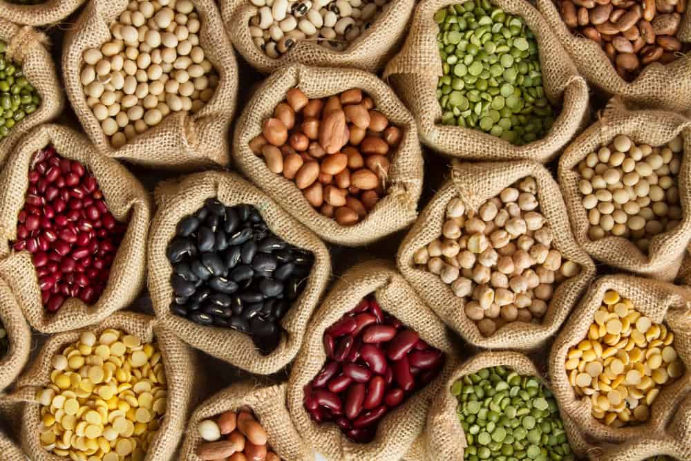 Various beans and legumes in rustic sacks.