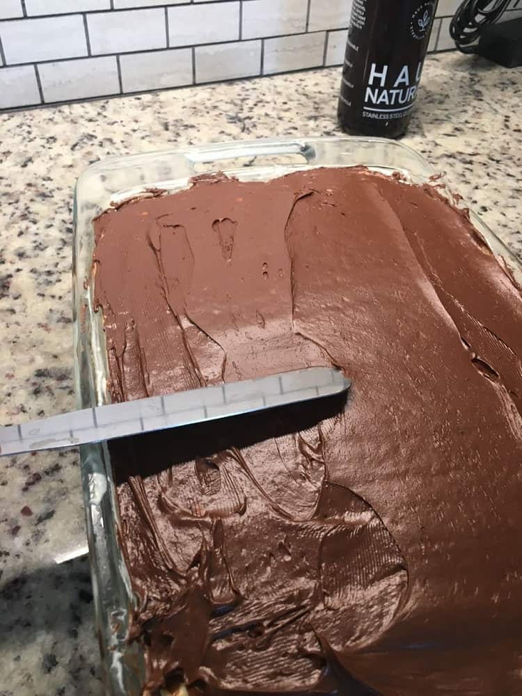 The layers are then topped with a chocolate layer.
