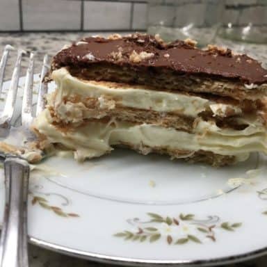 A slice of chocolate eclair cake on a plate.