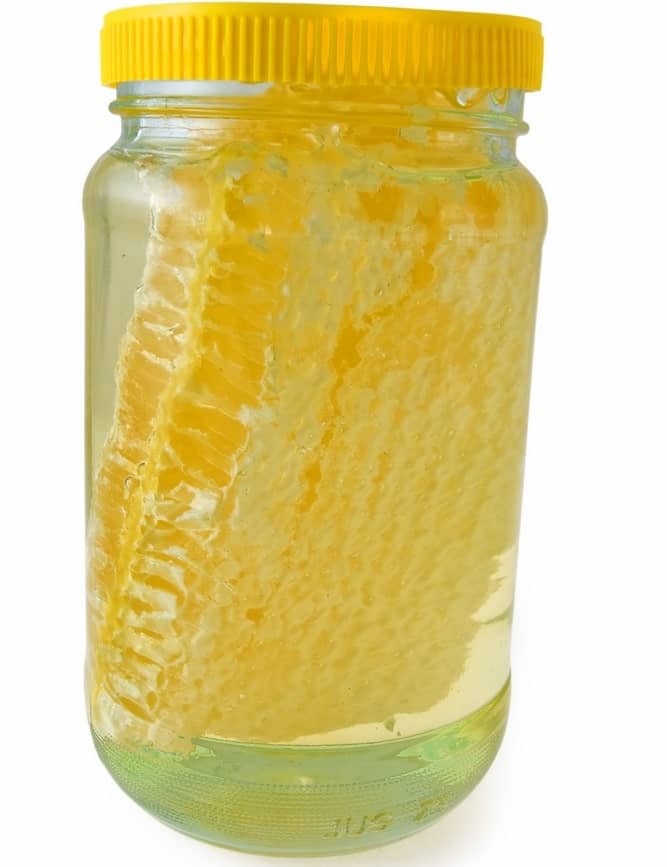 A jar of white acacia chunk honey.
