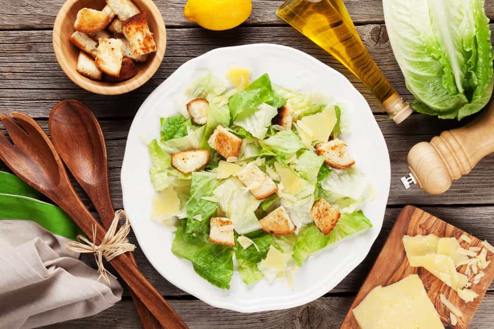 A freshly-made plate of Caesar salad.