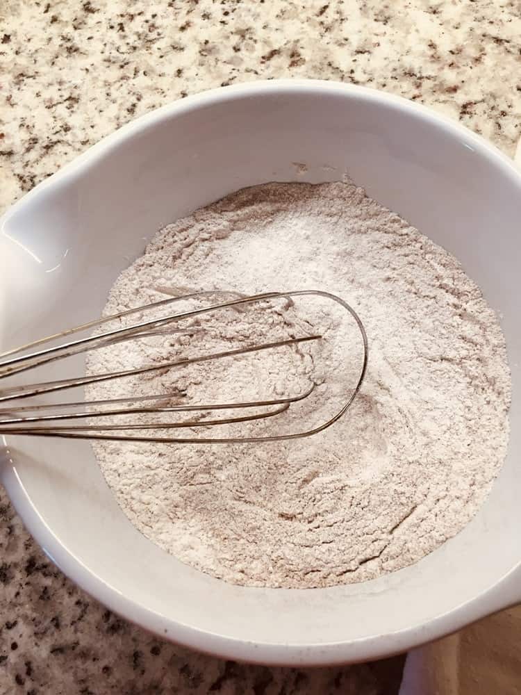 All the dry ingredients are mixed into a bowl.