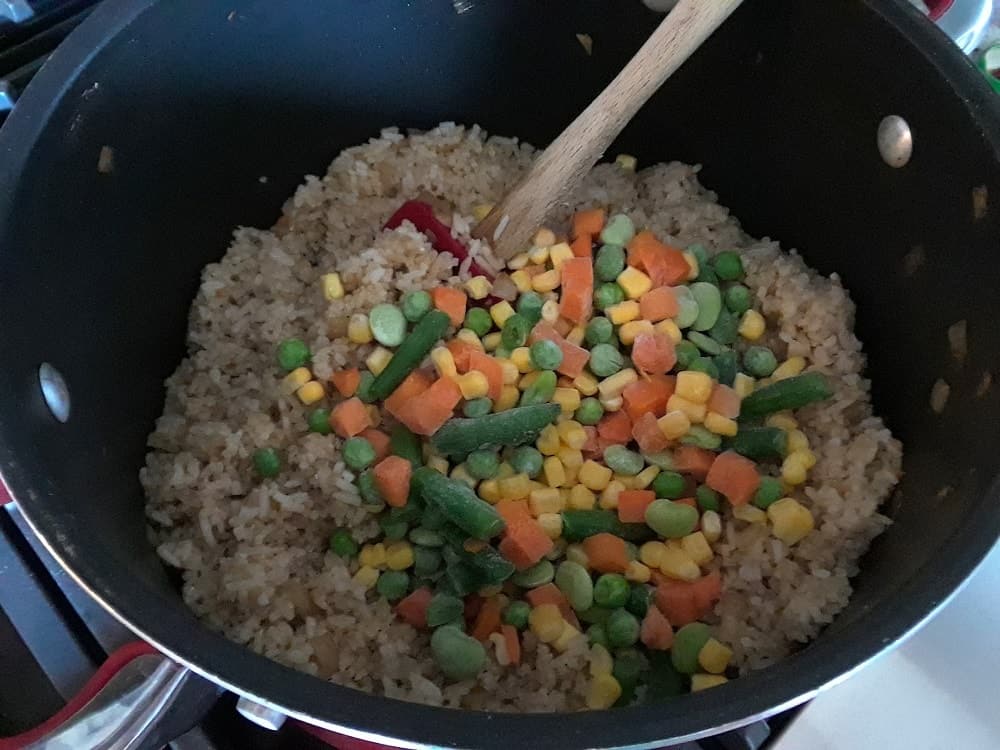 The vegetables are then added into the rice.