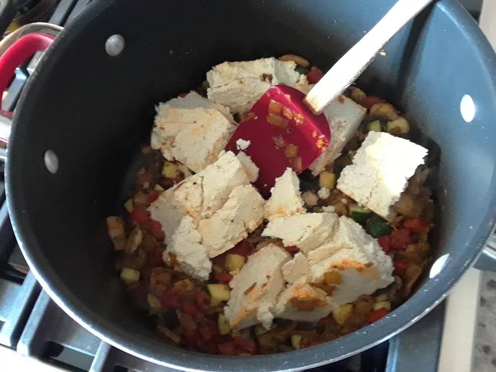 The tofu is then added into the sauteed vegetables.