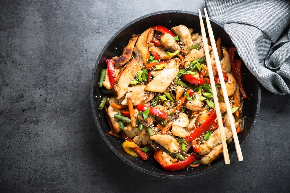 A bowl of freshly-cooked chicken stir fry.