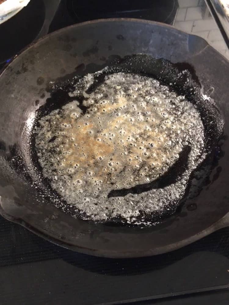 The butter is melted on a skillet.