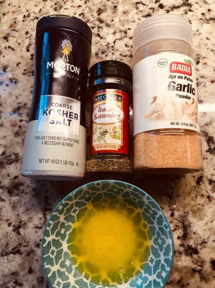 The complete set of ingredients for the garlic and herb layer.