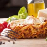 A close look at a fresh slice of homemade lasagna.