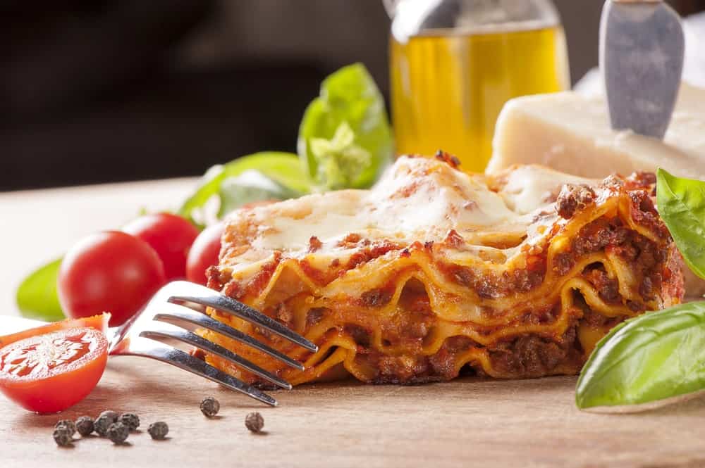 A close look at a fresh slice of homemade lasagna.