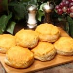 Freshly-baked Southern biscuits on a chopping board.