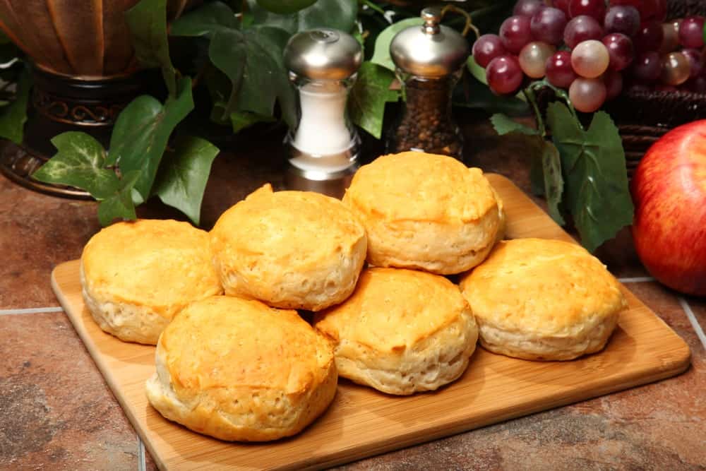 Freshly-baked Southern biscuits on a chopping board.