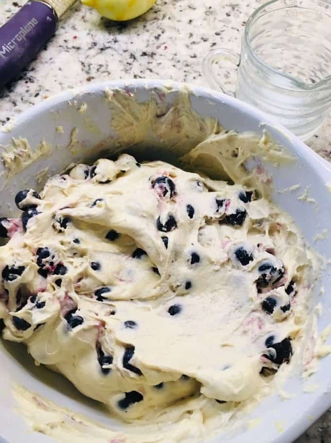 The blueberries are then folded into the batter.