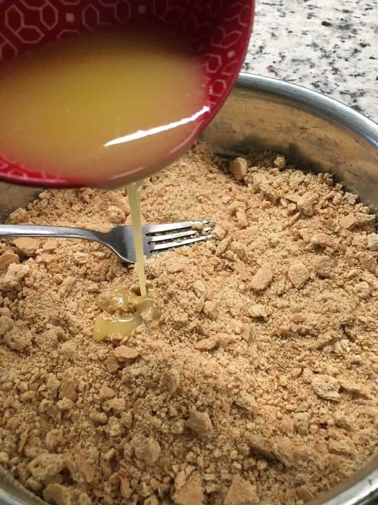 Butter is then added into the crushed crackers.