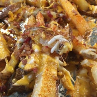 A close look at freshly-baked loaded potato wedges.