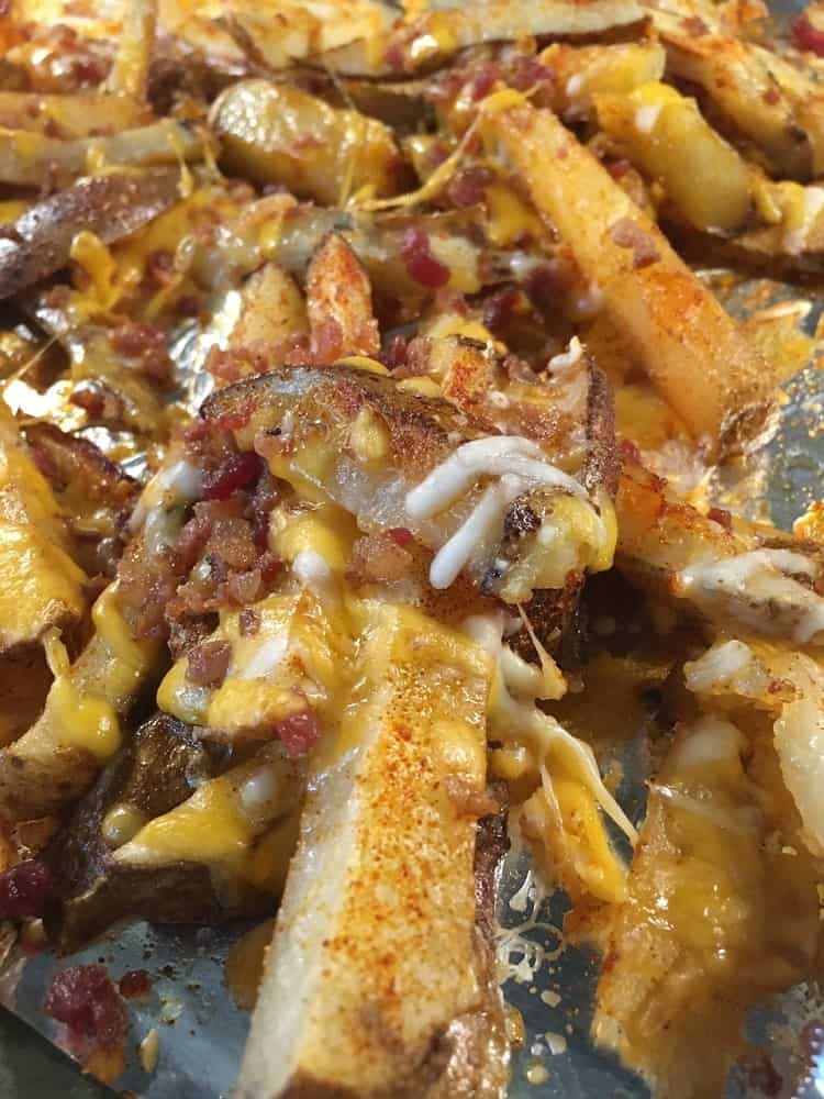 A close look at freshly-baked loaded potato wedges.
