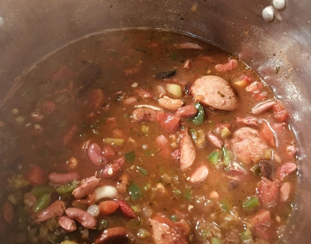 The ingredients are then mixed and the beans softened.