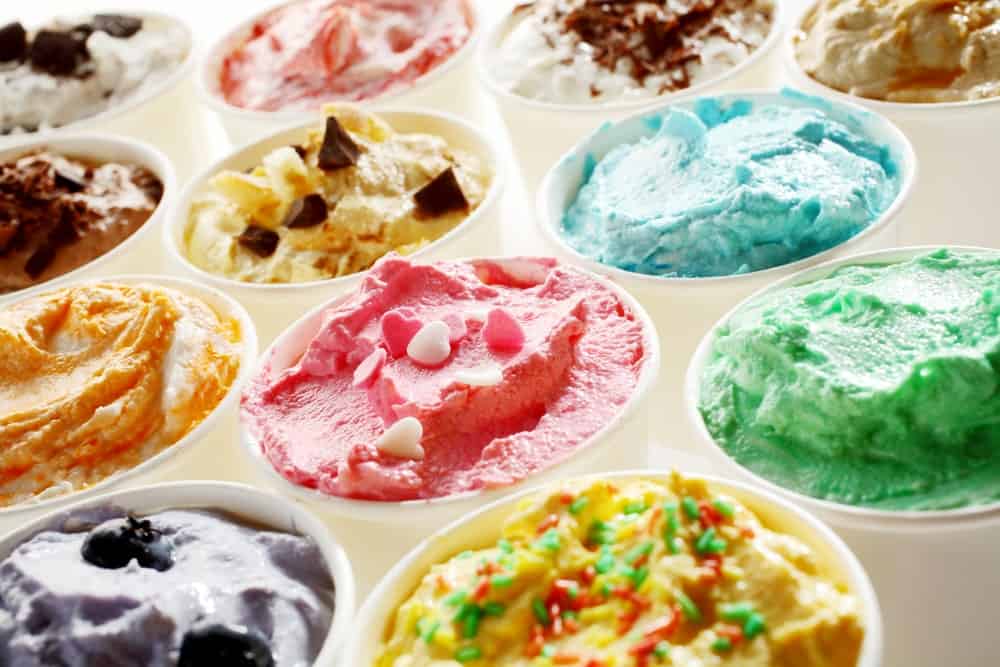 A close look at various different ice cream on display.