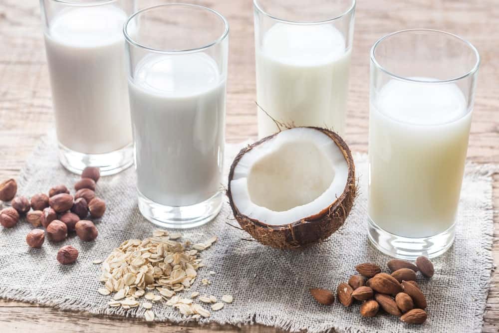 Glasses of different lactose-free milk alternatives.