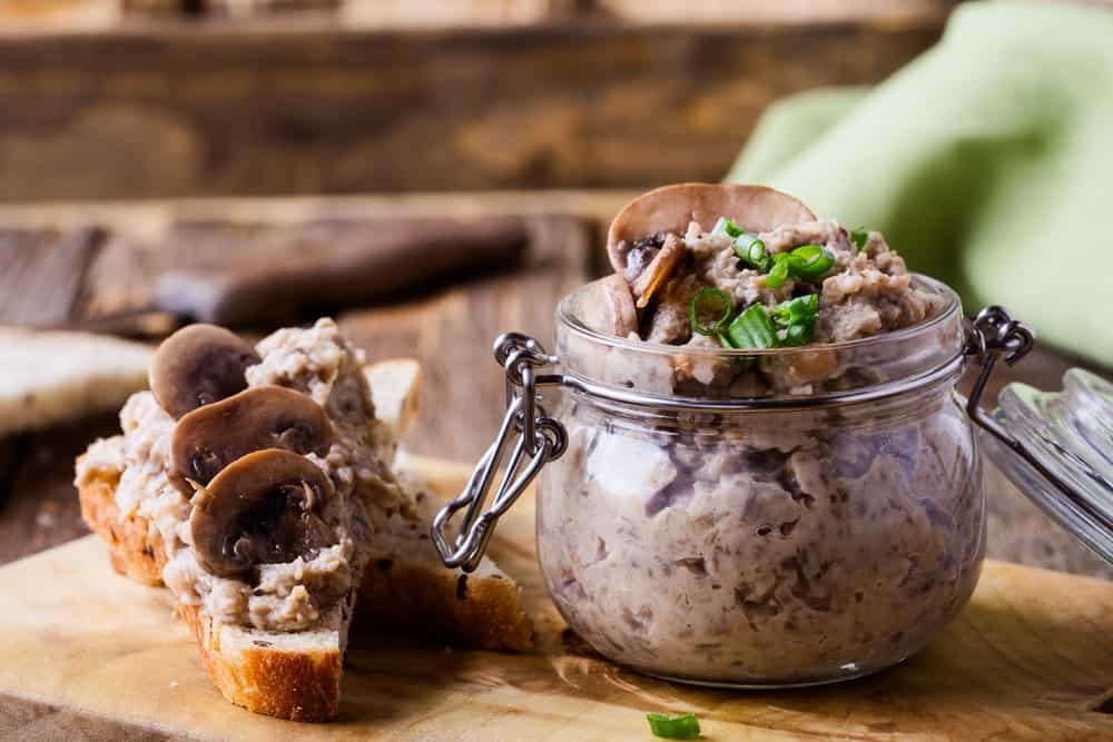 This is a jar of pate forestiere with mushrooms.