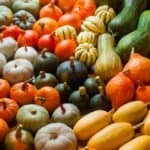 Bunches of various colorful squash.