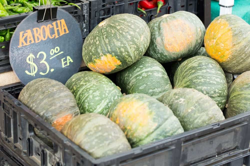 A bunch of kabocha squash on display for sale.