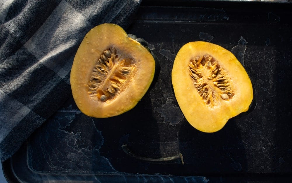 An acorn squash cut in half.