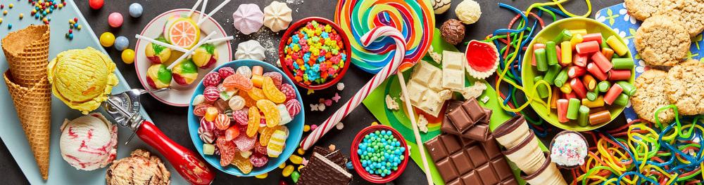 Colorful array of sweets in panoramic orientation.