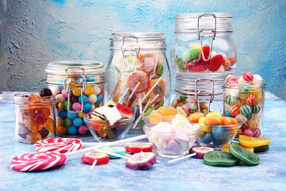 a bunch of sweet candy in jars