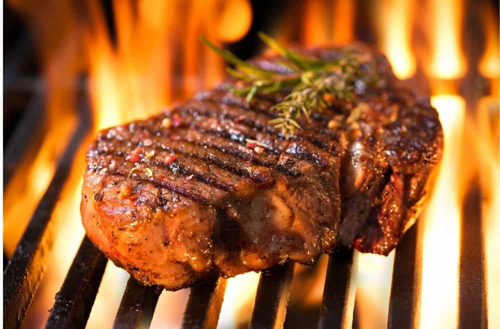 steak cooking on the grill