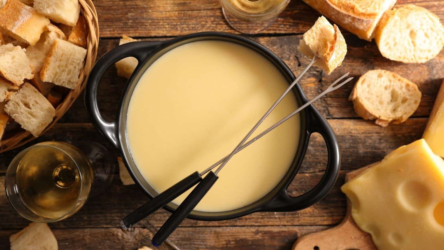 Switzerland's Cheesy Dish Gather Around the Fondue Pot!