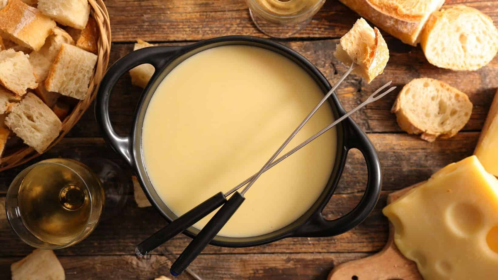 hot cheese in a fondue pot with bread