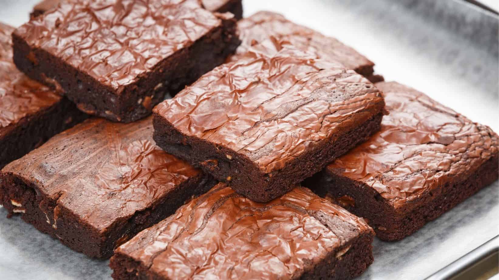 Plate of chewy brownies made from a cake mix.