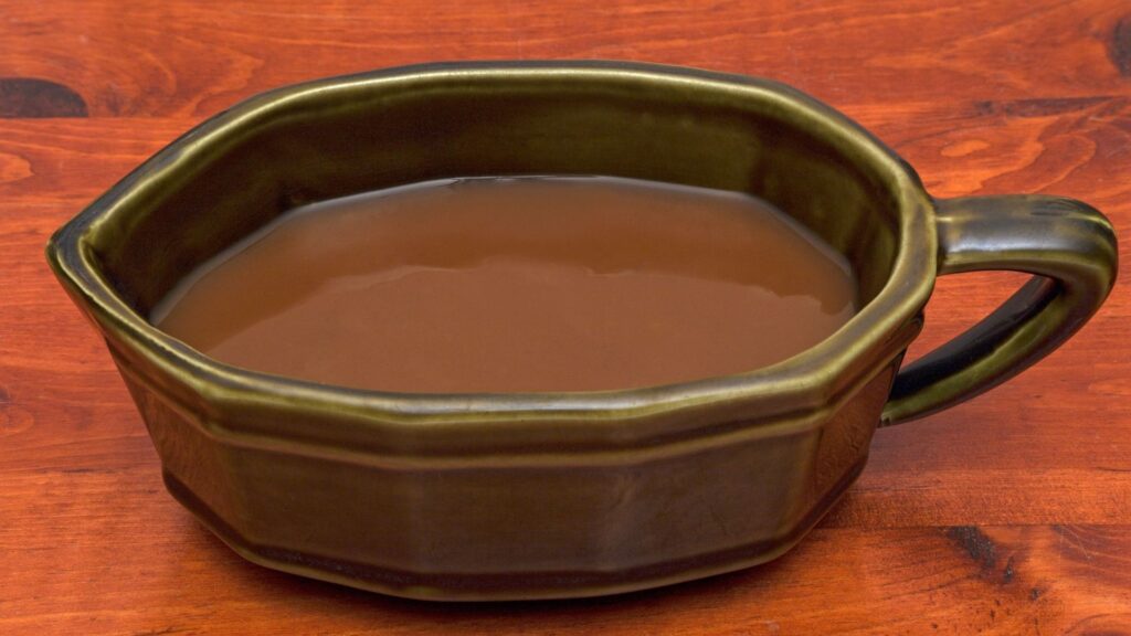 gravy boat filled with brown gravy