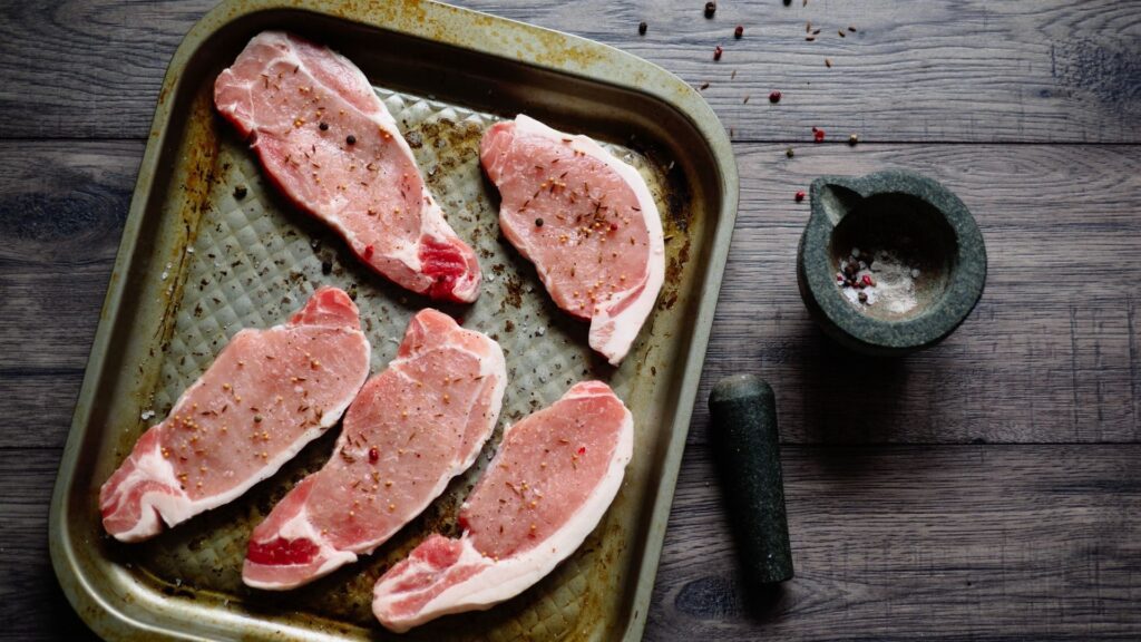 frozen pork chops ready to be cooked